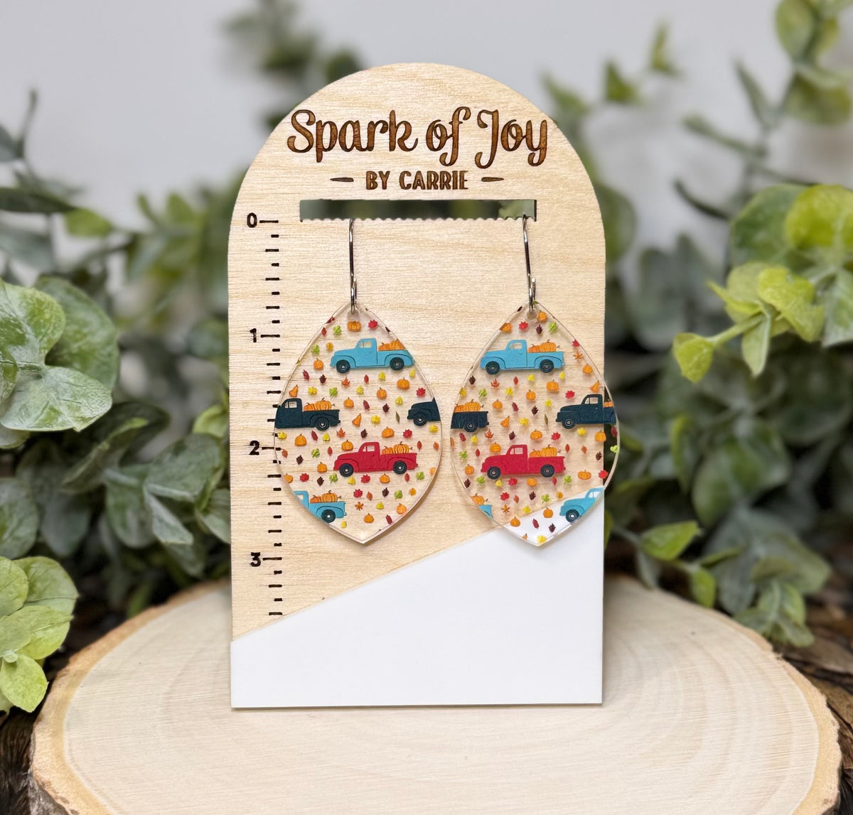Pumpkin truck drop earrings in clear acrylic on Spark of Joy display card